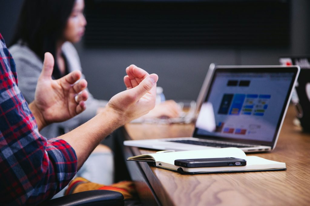 Man’s hands gesturing in meeting